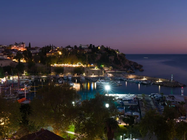 kusadasi-coastal-harbor-dusk-lighthouse-illuminated-town-waterfront-turkey