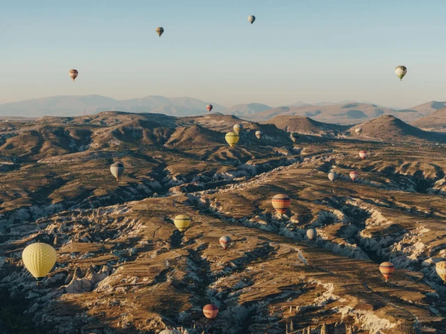 hot-air-balloons-cappadocia-scenic-valleys-mountain-horizon-sunrise-tour-turkey